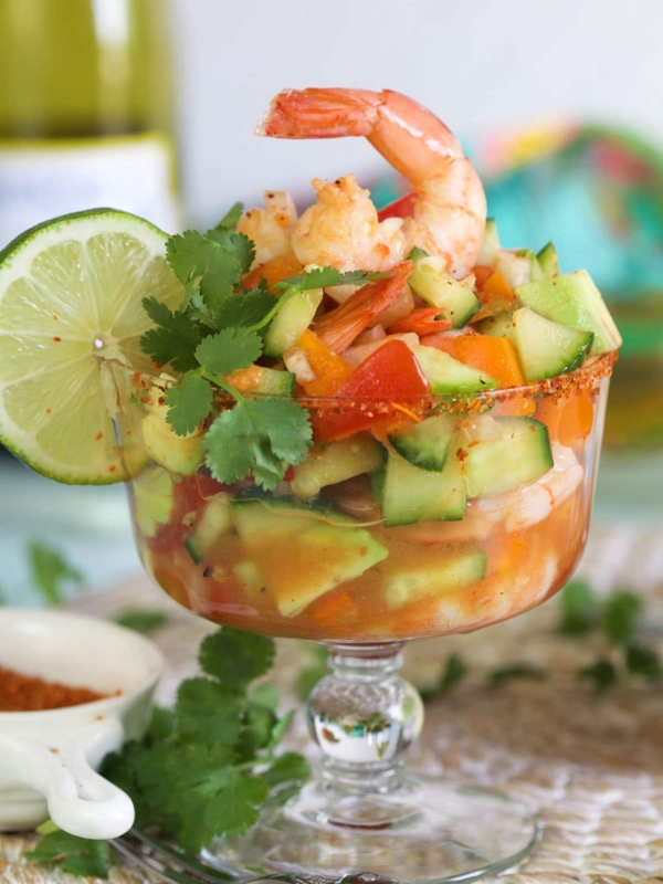A shrimp is placed on top of a shrimp cocktail.