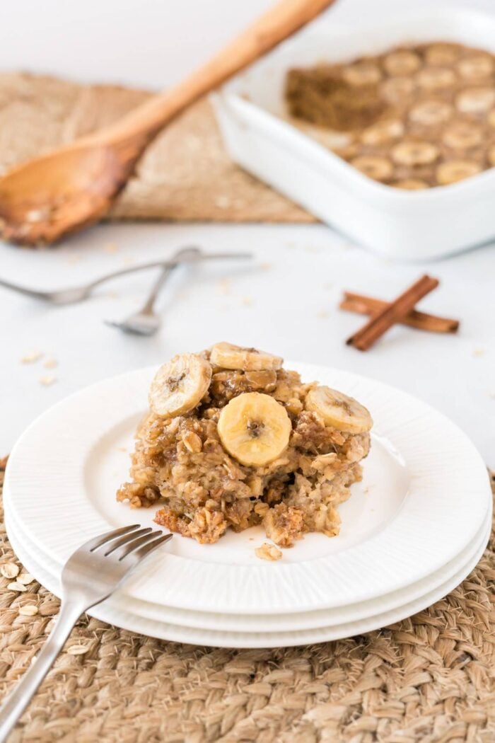 Bananas baked oatmeal on a white plate with a fork.