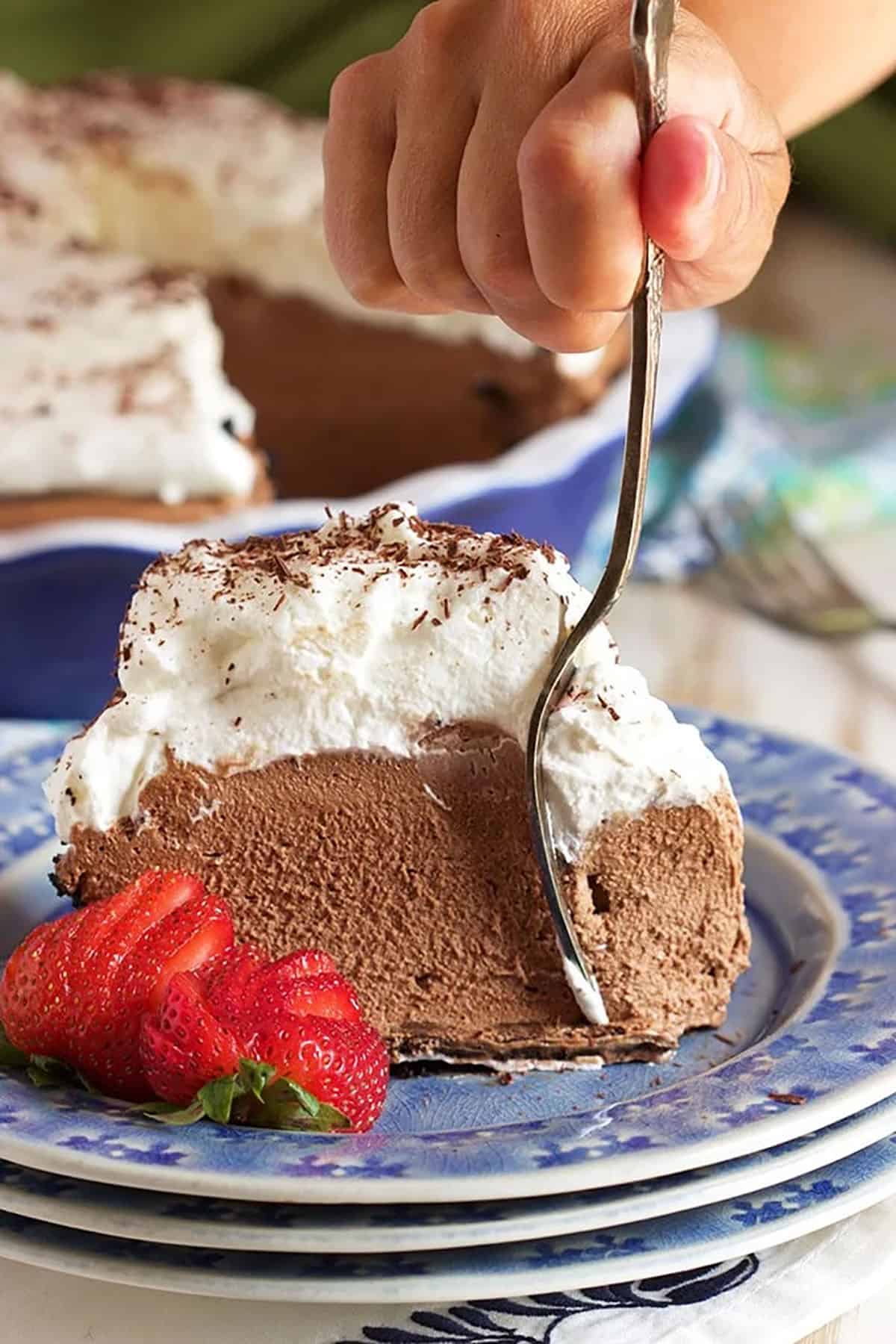 Chocolate Mousse Pie slice with a fork taking a bite.