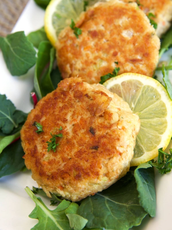 Tuna patties are on a white plate.