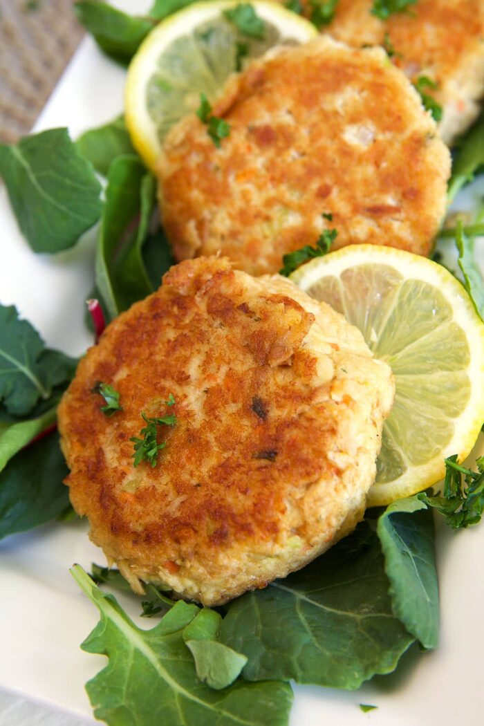 Tuna patties are on a white plate.