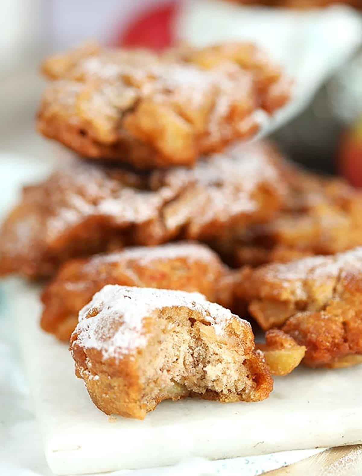 Close up of apple fritter with a bite taken 
