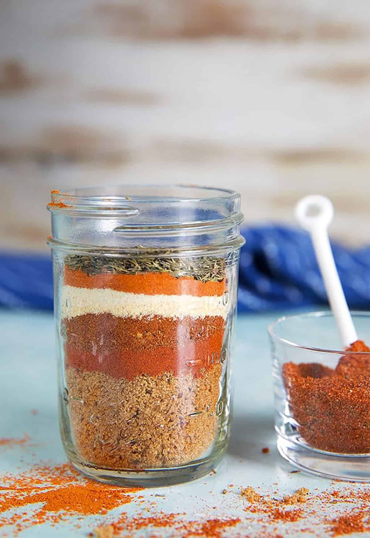 Dry Rub for chicken ingredients layered in a glass jar.
