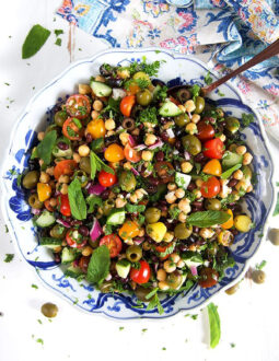 Overhead shot of Mediterranean Chickpea Salad in a blue and white bowl.