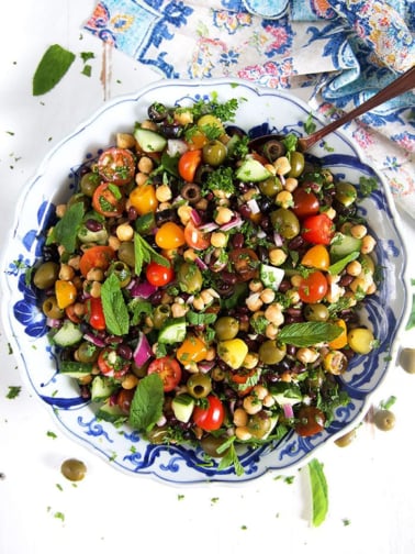 Overhead shot of Mediterranean Chickpea Salad in a blue and white bowl.