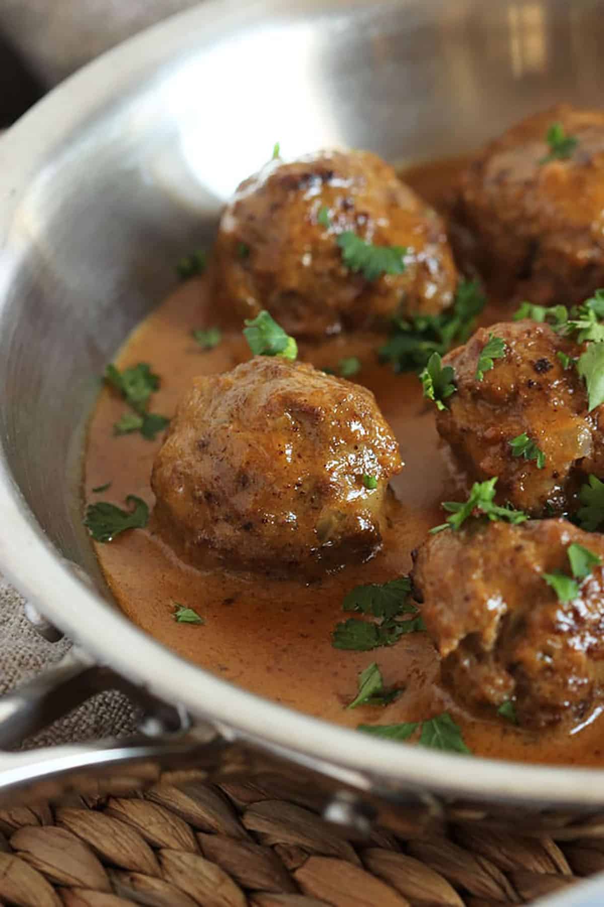 Swedish Meatballs in a stainless steel skillet.