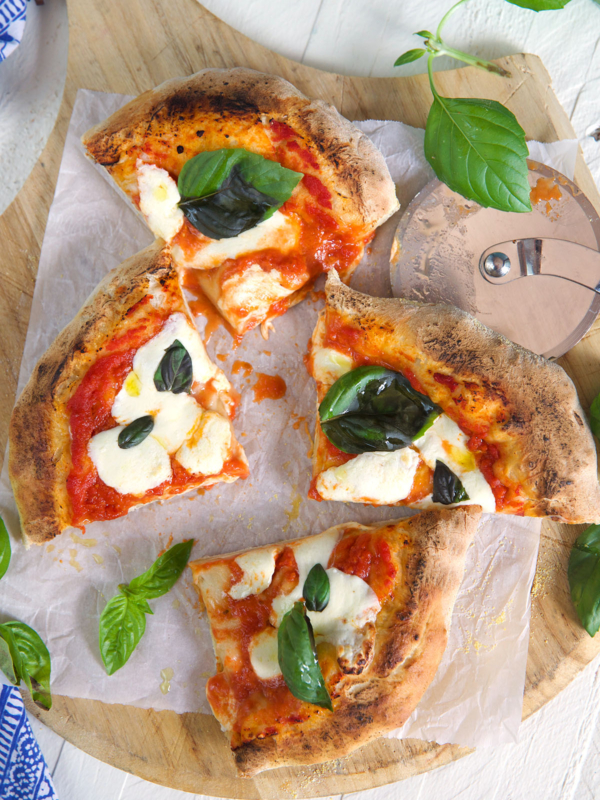 A pizza has been cut into four slices.
