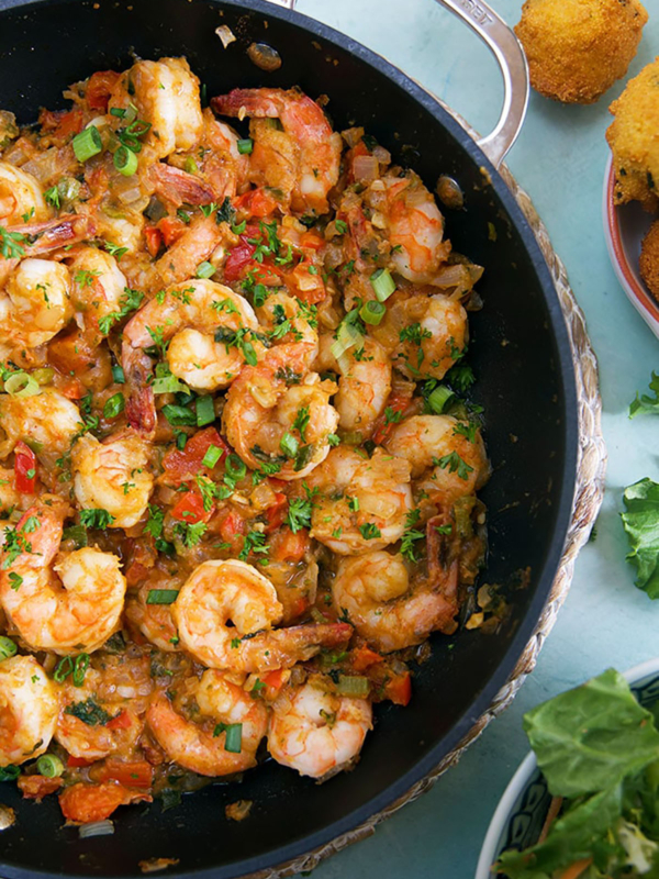 Overhead shot of shrimp etouffee in a black le creuset skillet.