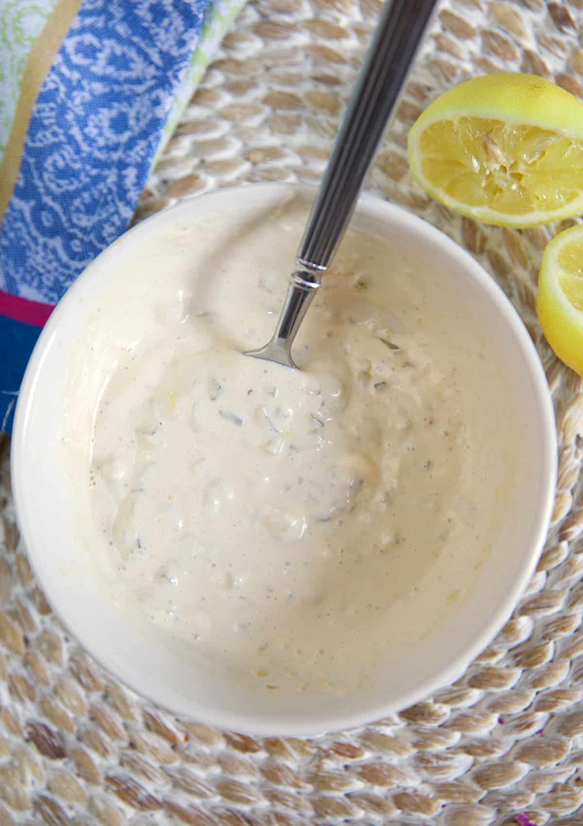 Tartar sauce has been mixed thoroughly in a white bowl. 