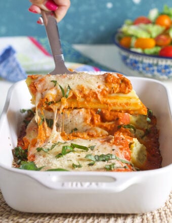 Manicotti being served with a spatula