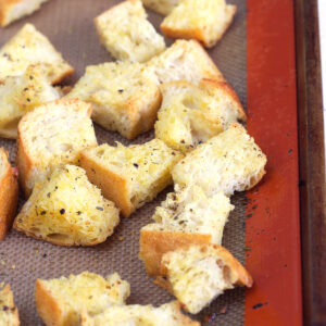 Croutons are baked on a siplat baking sheet.