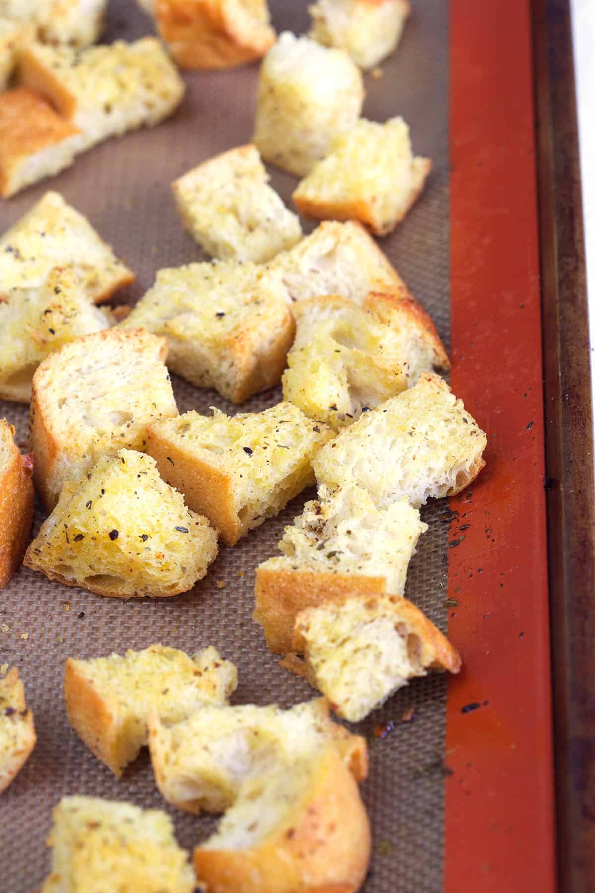 Croutons are baked on a siplat baking sheet. 