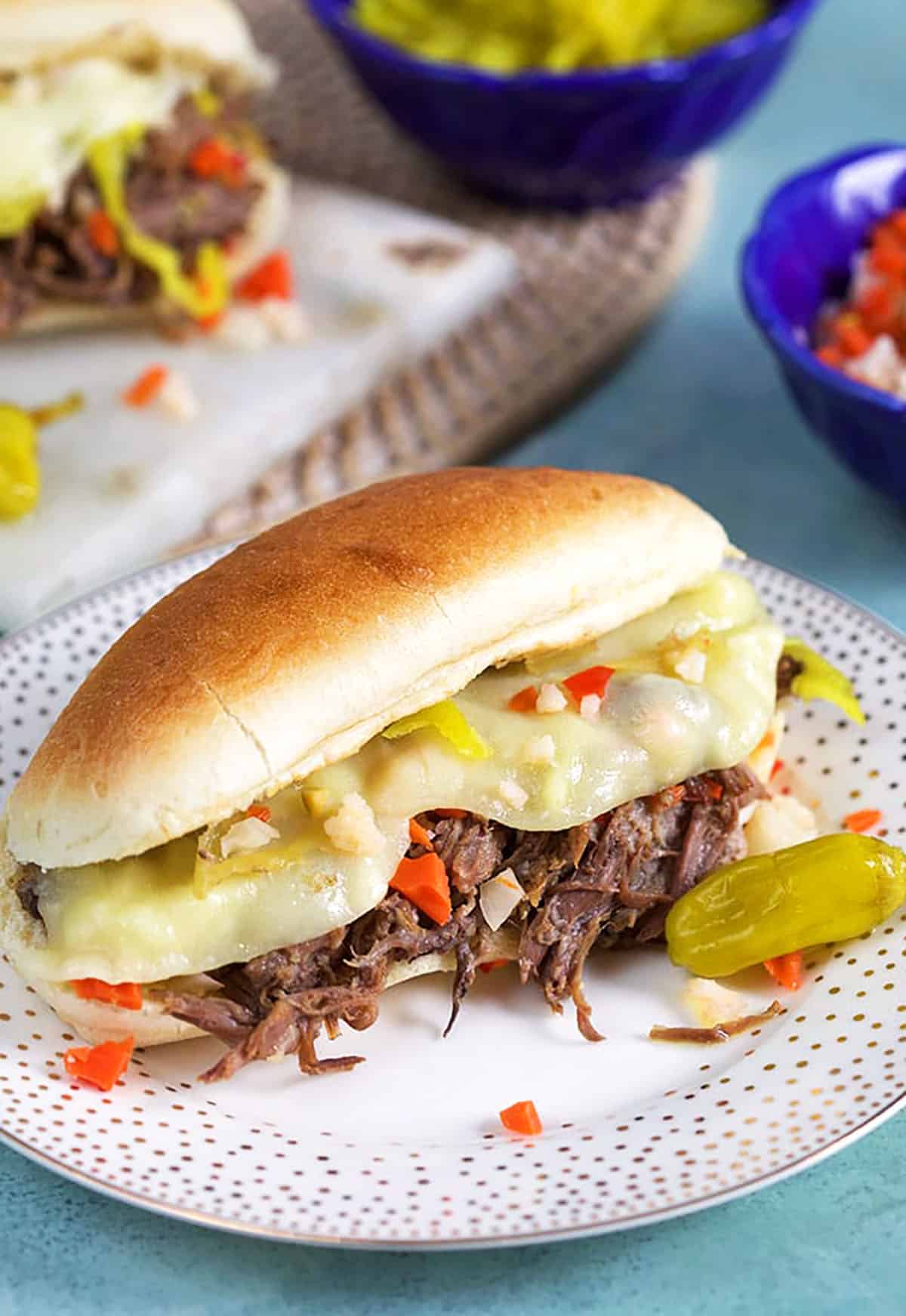 Shredded Italian Beef on a long roll with giardiniera and melted cheese. 