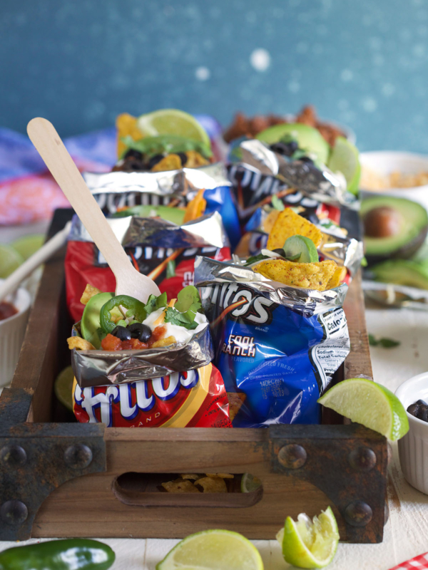 Multiple walking tacos are presented on a white surface.