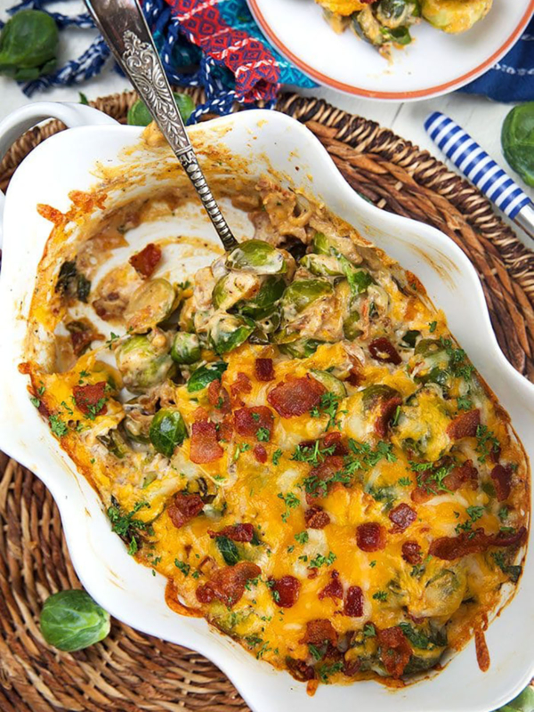 Overhead shot of brussel sprout casserole in a white baking dish.