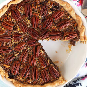 Overhead shot of Chocolate Pecan Pie in a white pie plate.