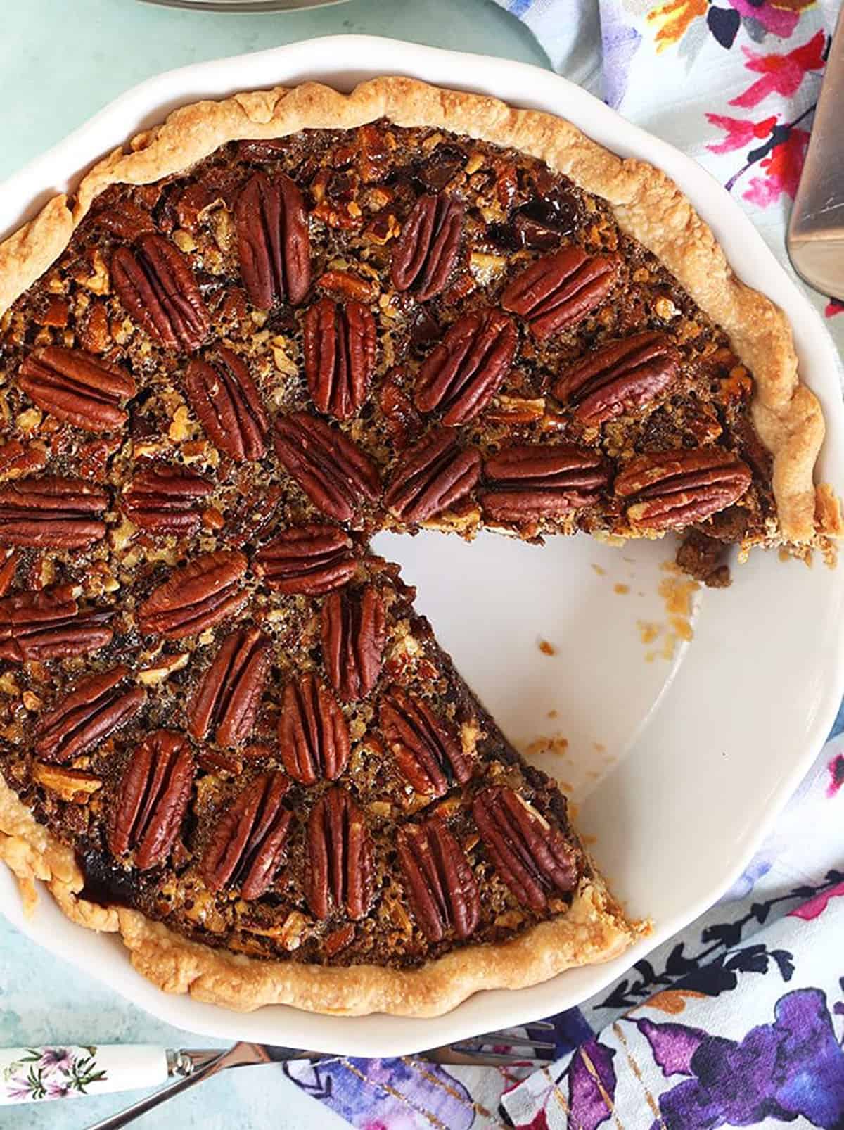 Overhead shot of Chocolate Pecan Pie in a white pie plate.