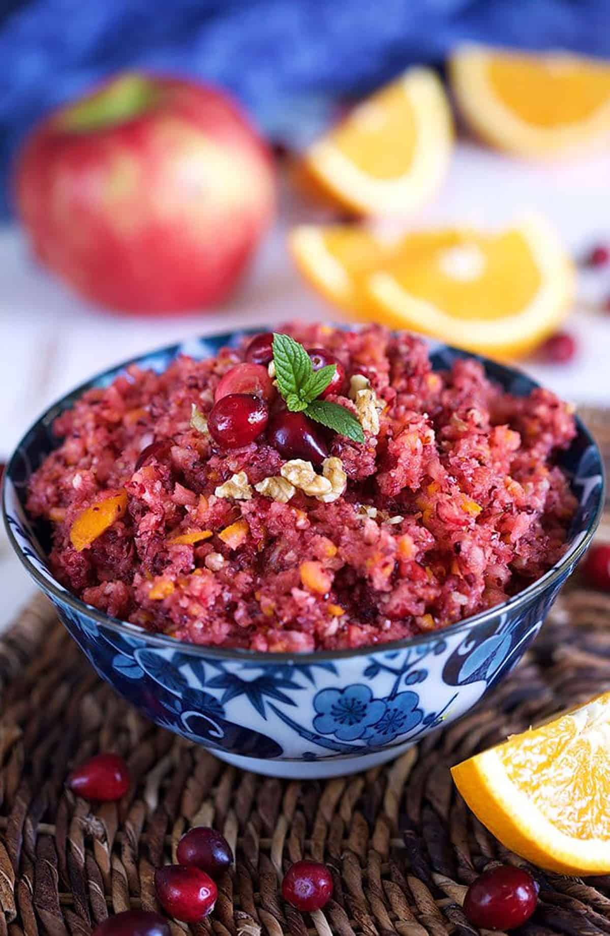 Cranberry orange relish in a blue and white bowl.