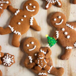 Gingerbread men cookies on a distressed wood background.