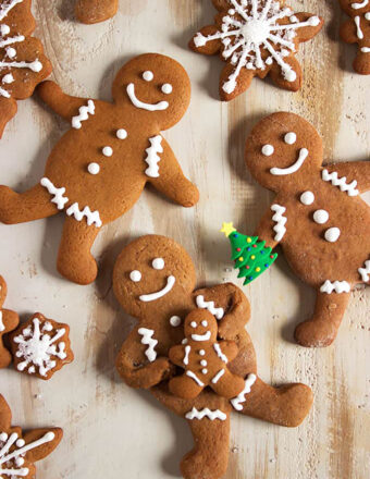 Gingerbread men cookies on a distressed wood background.