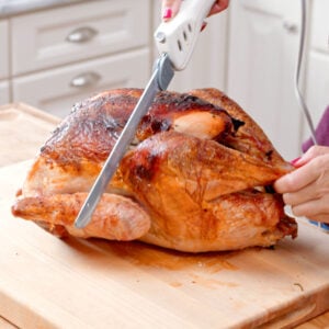 Leg being cut off a turkey