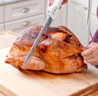 Leg being cut off a turkey