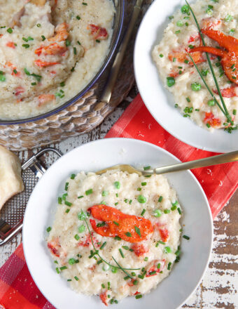 Two bowls of risotto are placed next to a half full pot.