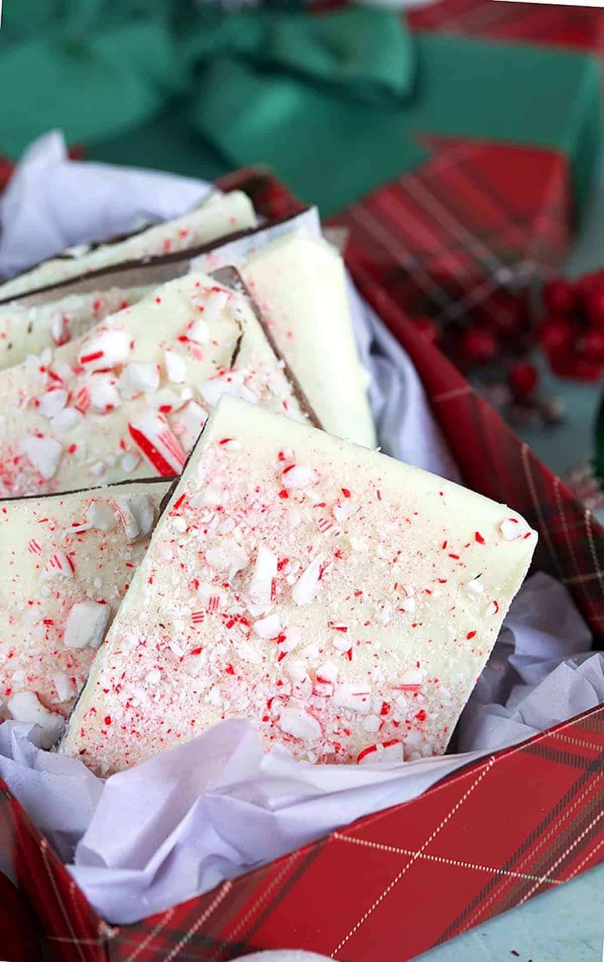 Close up of peppermint bark in a gift box.