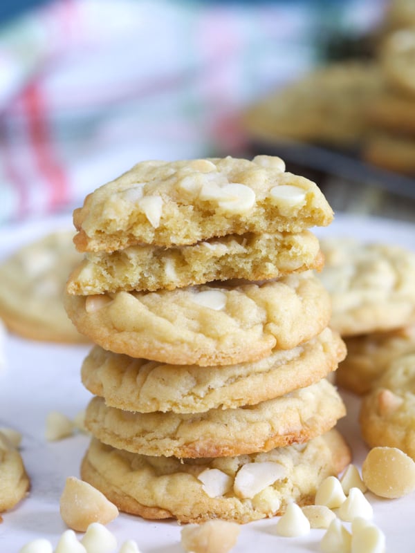 A stack of cookies is presented on a white surface.
