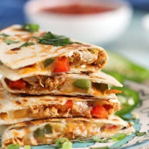 Stack of chicken quesadillas on a plate
