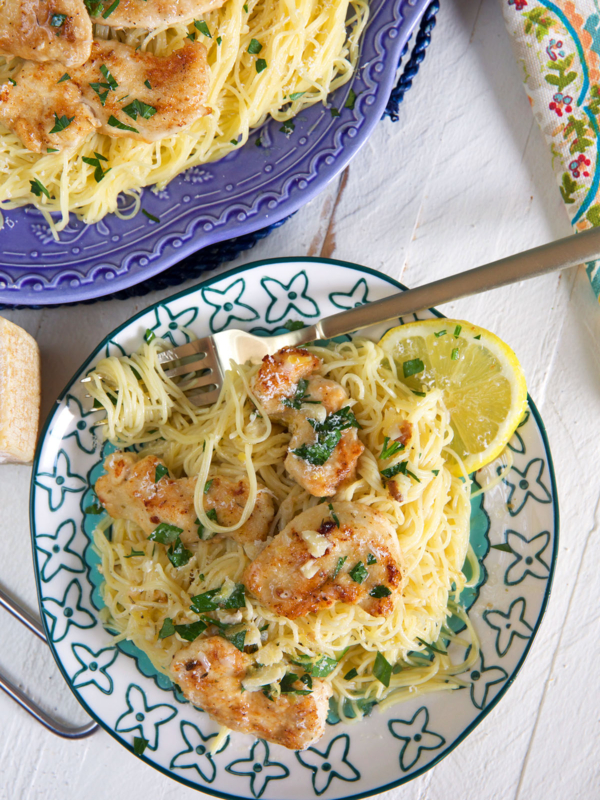 A fork has been placed on a pate filled with chicken scampi.