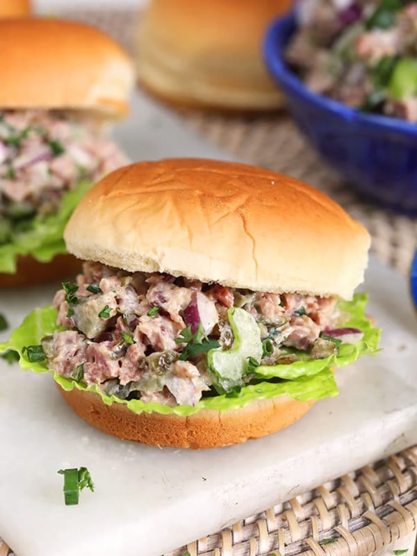Close up of ham salad sandwich on a potato roll.