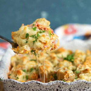 Reuben casserole being served with a spatula from a baking dish.