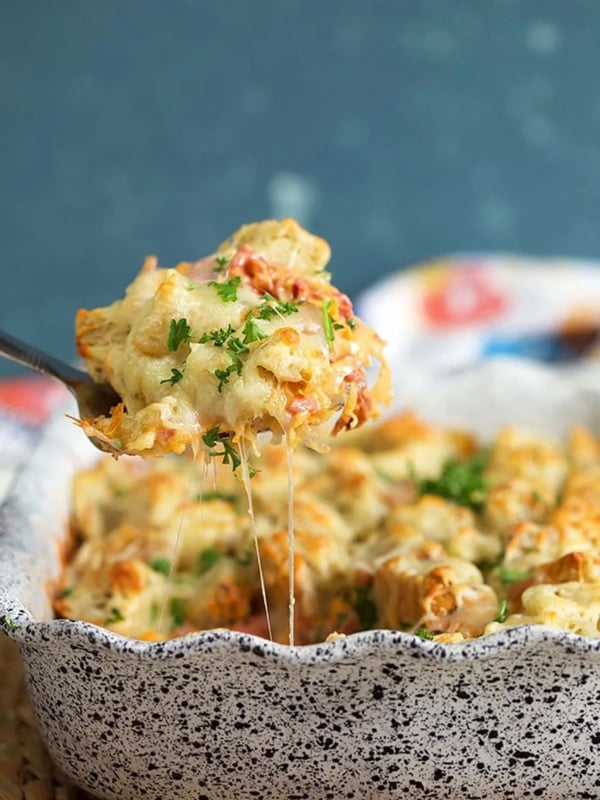 Reuben casserole being served with a spatula from a baking dish.