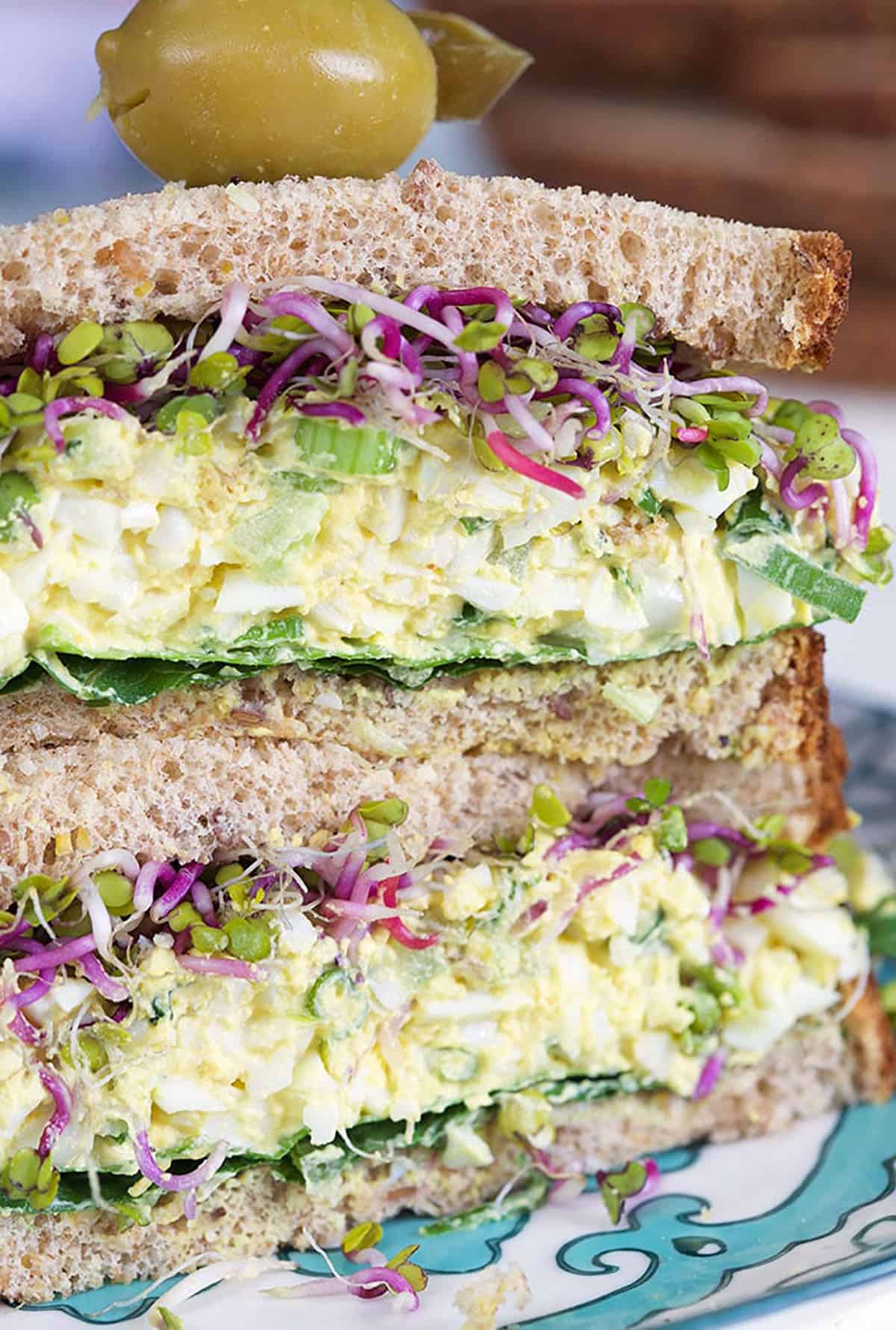 Close up of egg salad sandwich on wheat bread 
