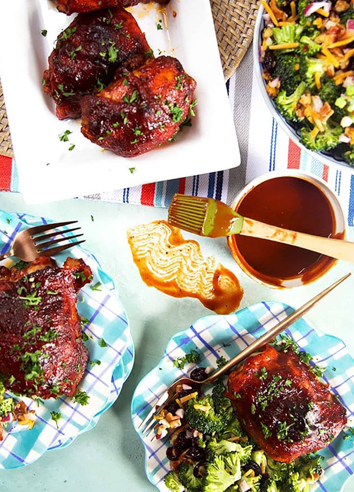 Overhead shot of bbq chicken dinner with broccoli salad.