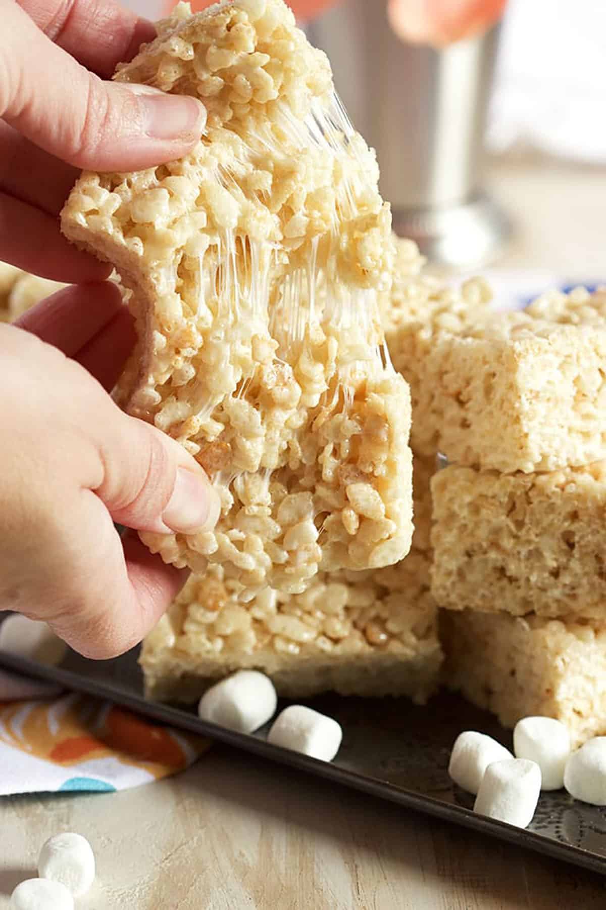 Rice Krispie Treat being pulled apart with a gooey center.