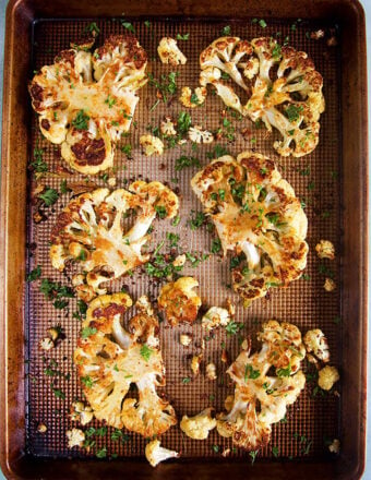 Baked Cauliflower Steaks on a sheet pan.