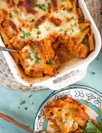 overhead shot of baked rigatoni in a white baking dish.