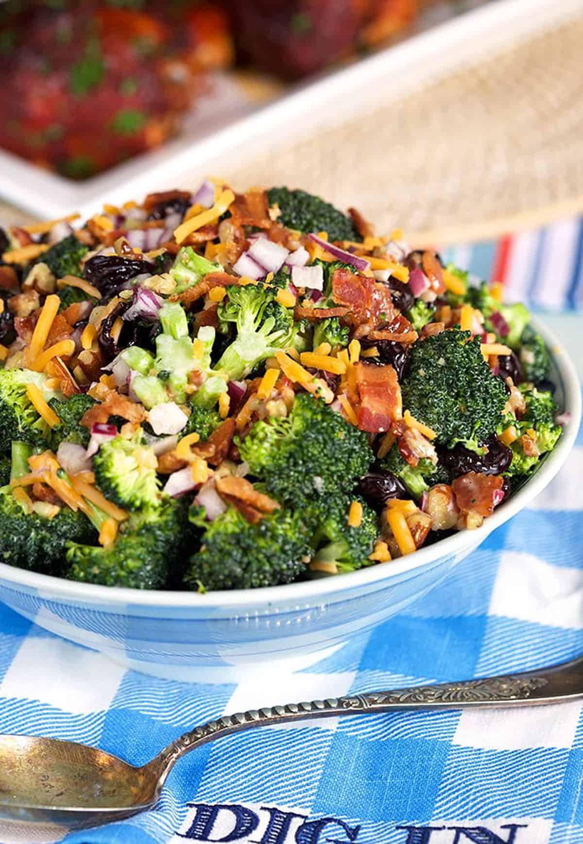 Broccoli Salad in a blue and white bowl.
