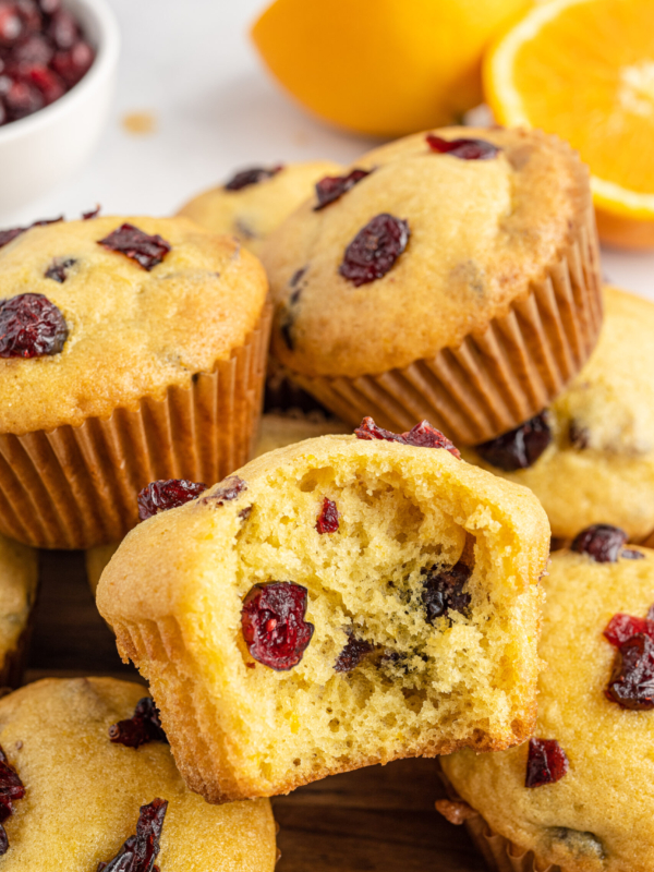 A muffin has been bitten into, revealing a cooked through center.