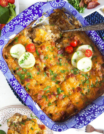 Overhead shot of tater tot casserole hotdish in a blue and white casserole dish.