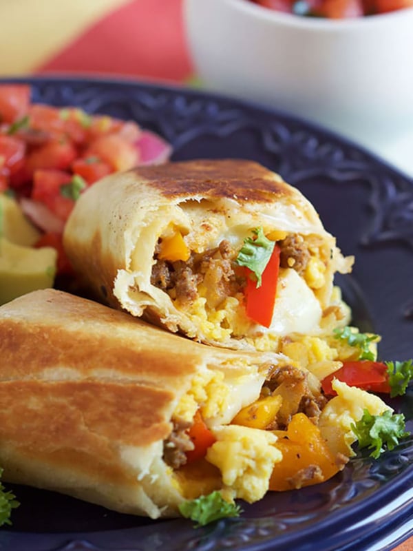 Chorizo and eggs burrito on a blue plate