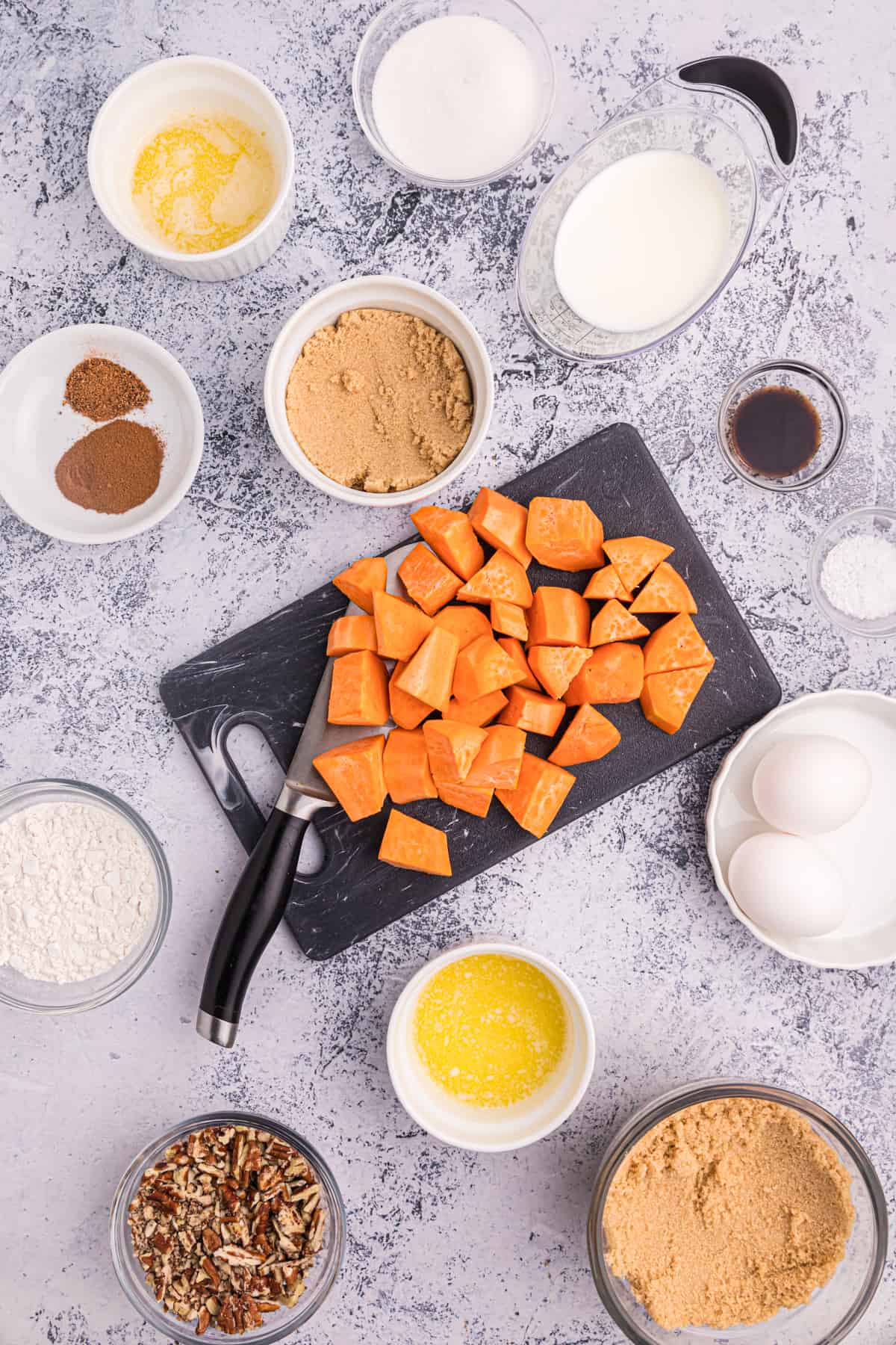 The ingredients for sweet potato souffle are placed on a countertop. 