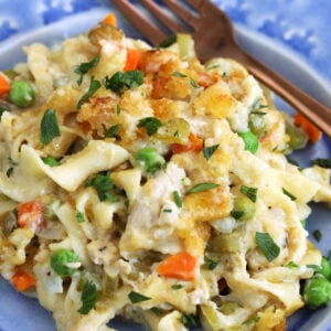 Tuna noodle casserole in bowl with fork