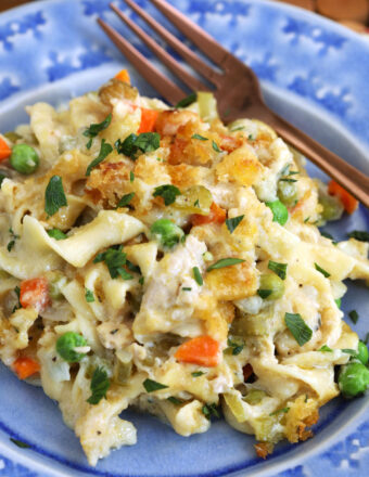 Tuna noodle casserole in bowl with fork