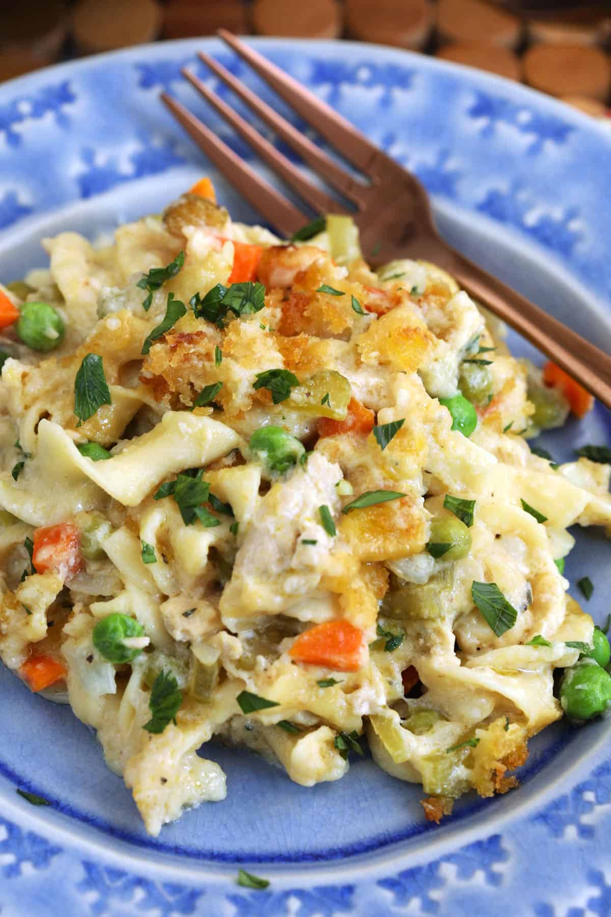 Tuna noodle casserole in bowl with fork