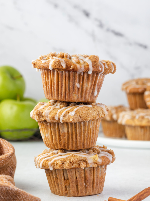 Three muffins are stacked on top of one another.