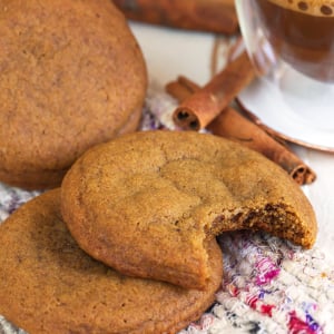 Ginger snap cookies on a tweed blanket.