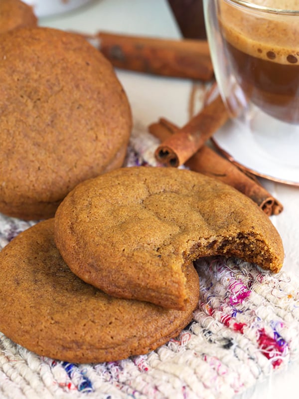 Ginger snap cookies on a tweed blanket.
